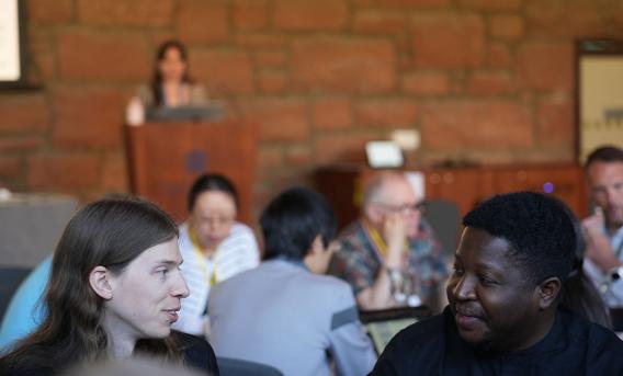 Conference with seated audience and speaker