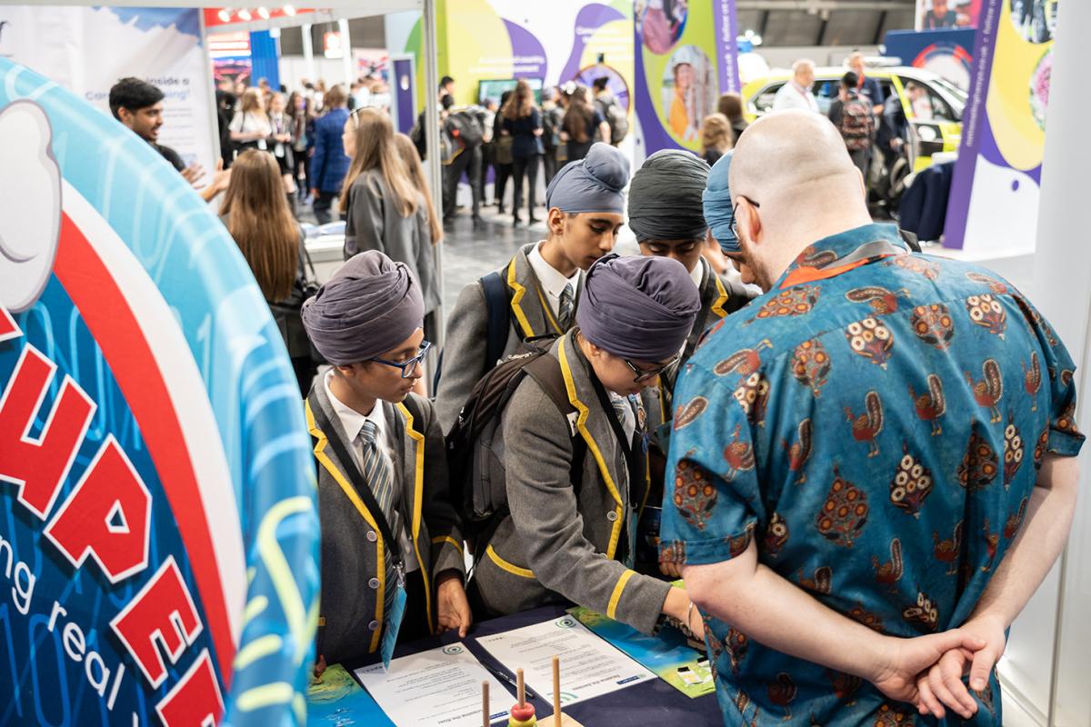 BBF 23: school children at the EPCC stand, looked over by EPCC staff