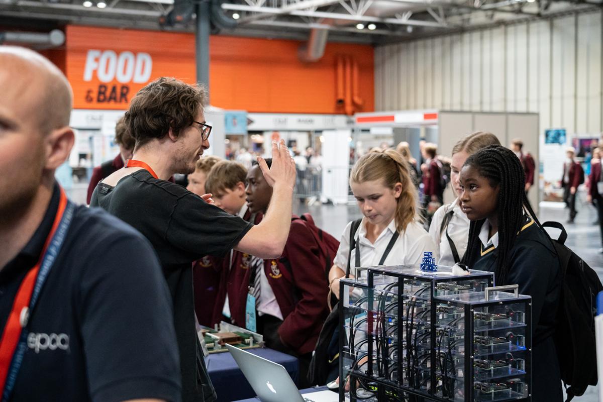 EPCC stand at BBF. Image shows explaining a topic to school girls.