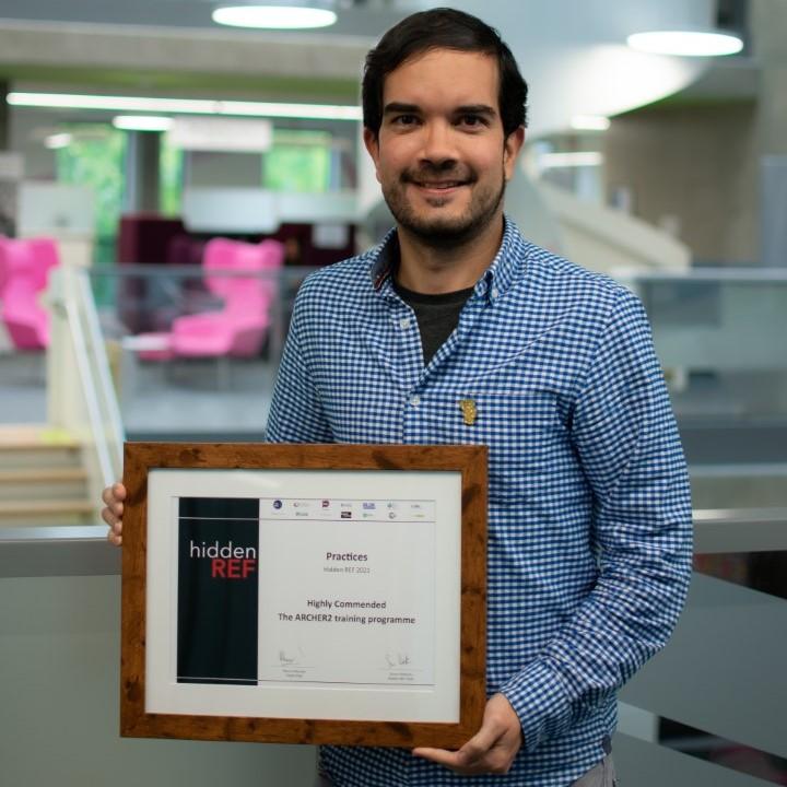 Juan Herrera holding the Hidden REF 2021 diploma