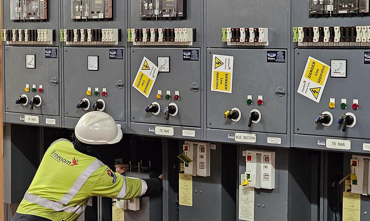 High Voltage specialist removing a 11000Volt Circuit Breaker for Inspection & Maintenance.