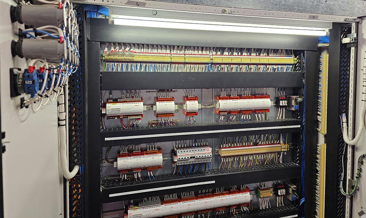 Inside view of BMS (Building Management System) control panel showing Outstations which control automation of M&E plant.