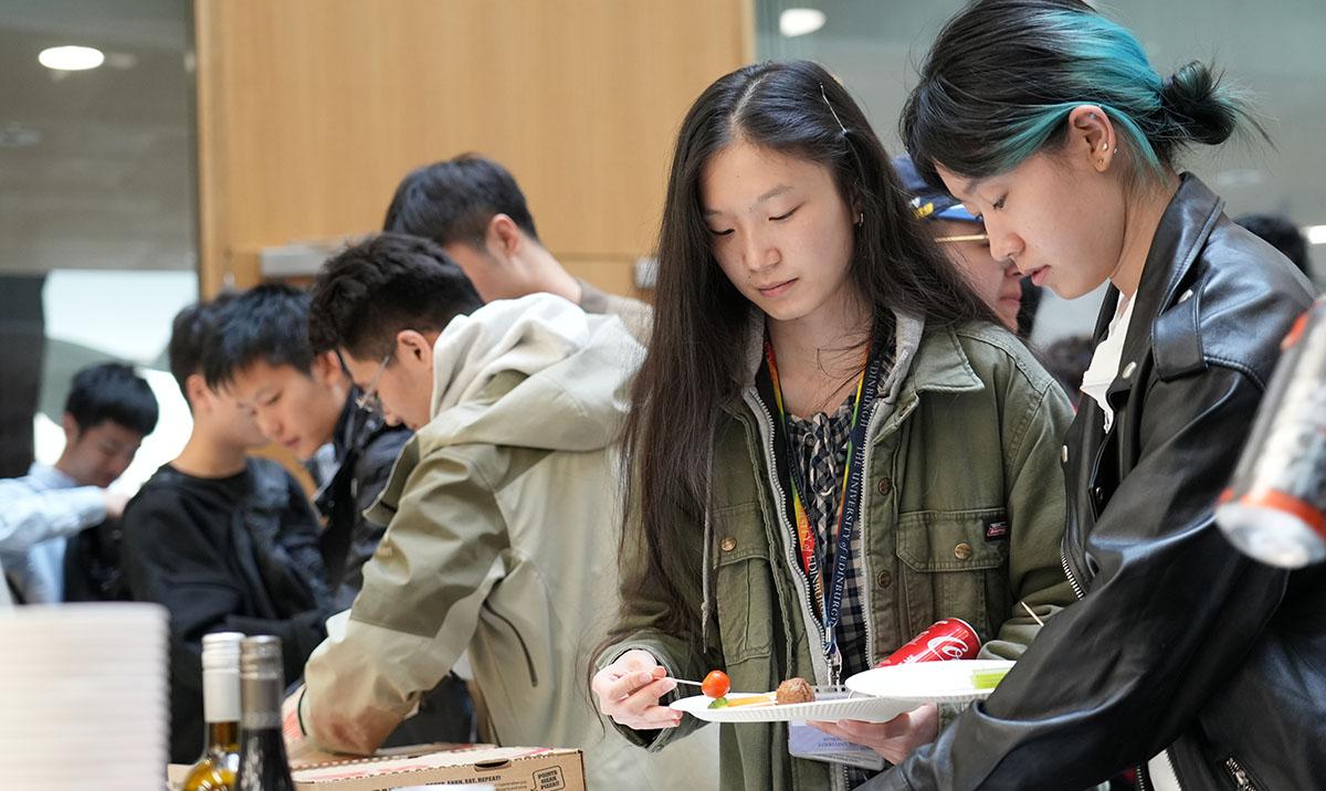 Students at Welcome Week reception in Bayes Centre.